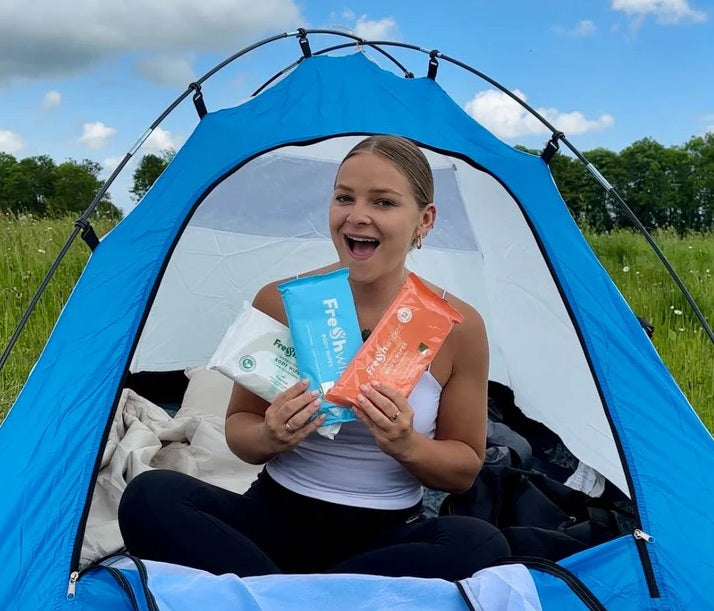 camper with collection of body wipes