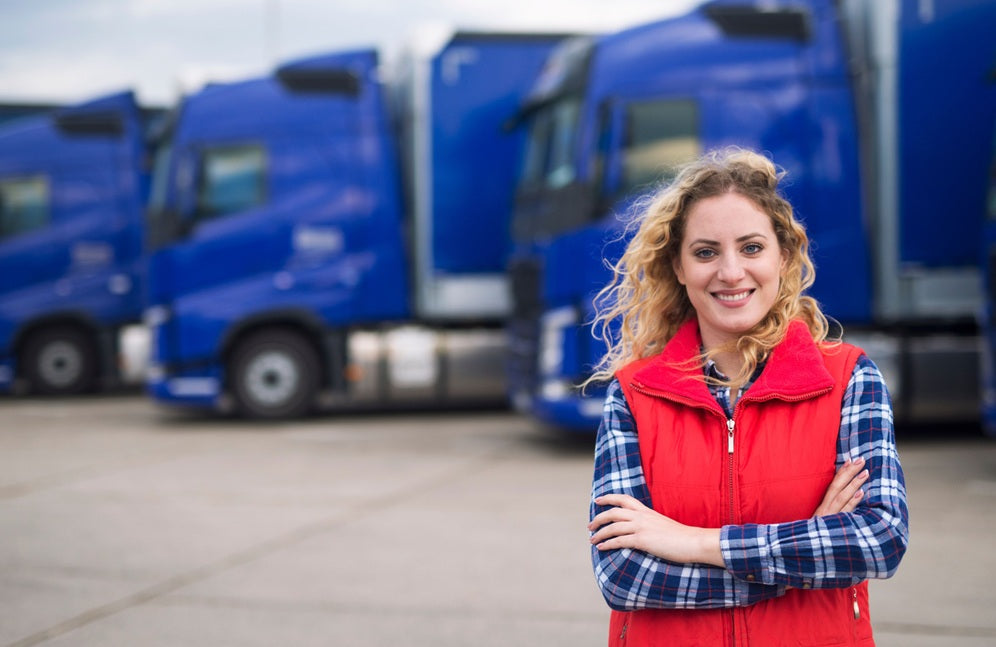Woman standing in front of lorries