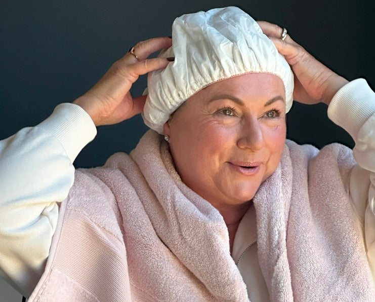 Lady using shampoo cap