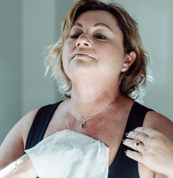 Lady using body wipe to wash