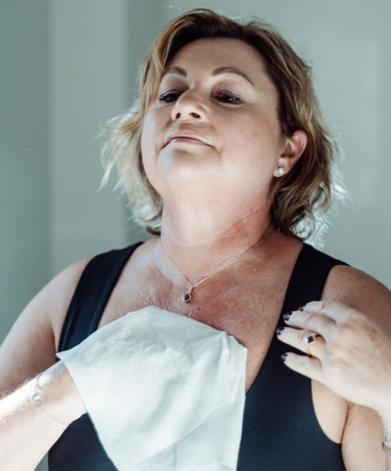 Lady washing with body wipes