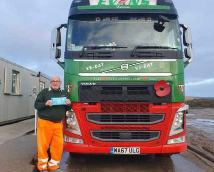 Richard posing with body wipes next to his truck
